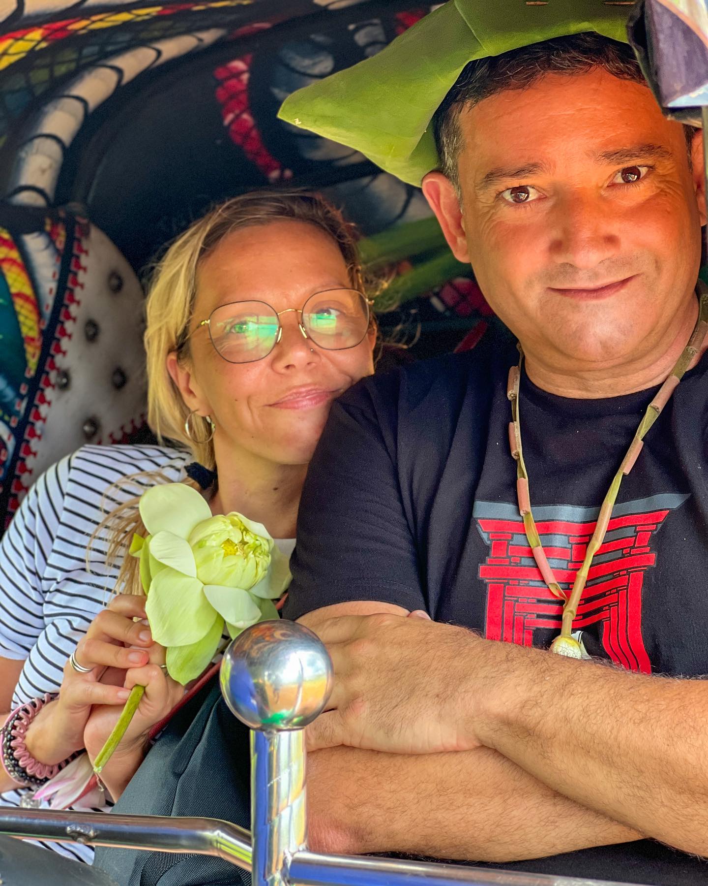 Couple in colorful tuk-tuk