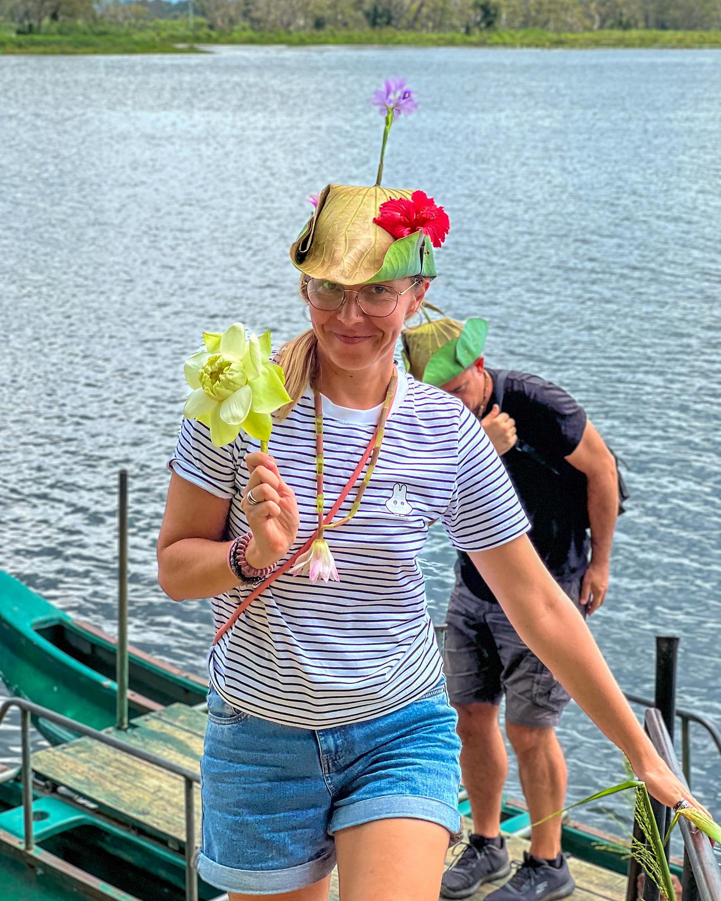 Woman with lotus flower and leaf hat